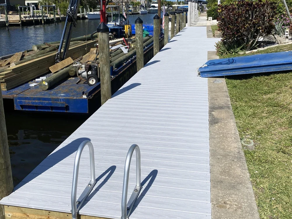 Top Notch Docks marine construction work beside a finished waterfront dock