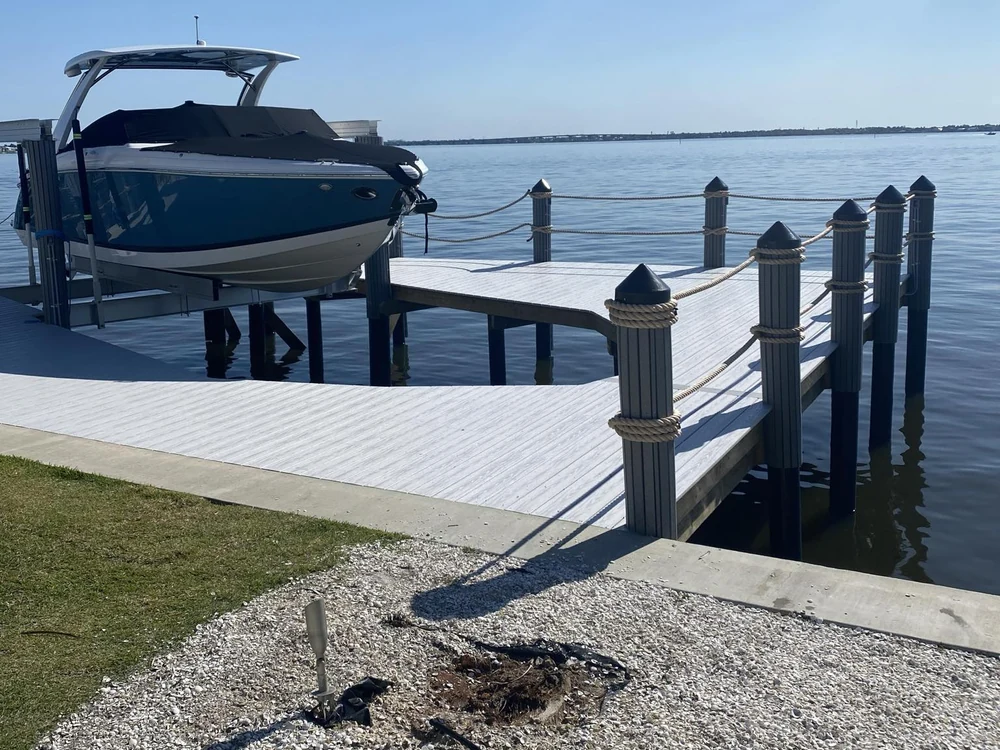 Finished dock and new boat lift project from the Top Notch Docks project library