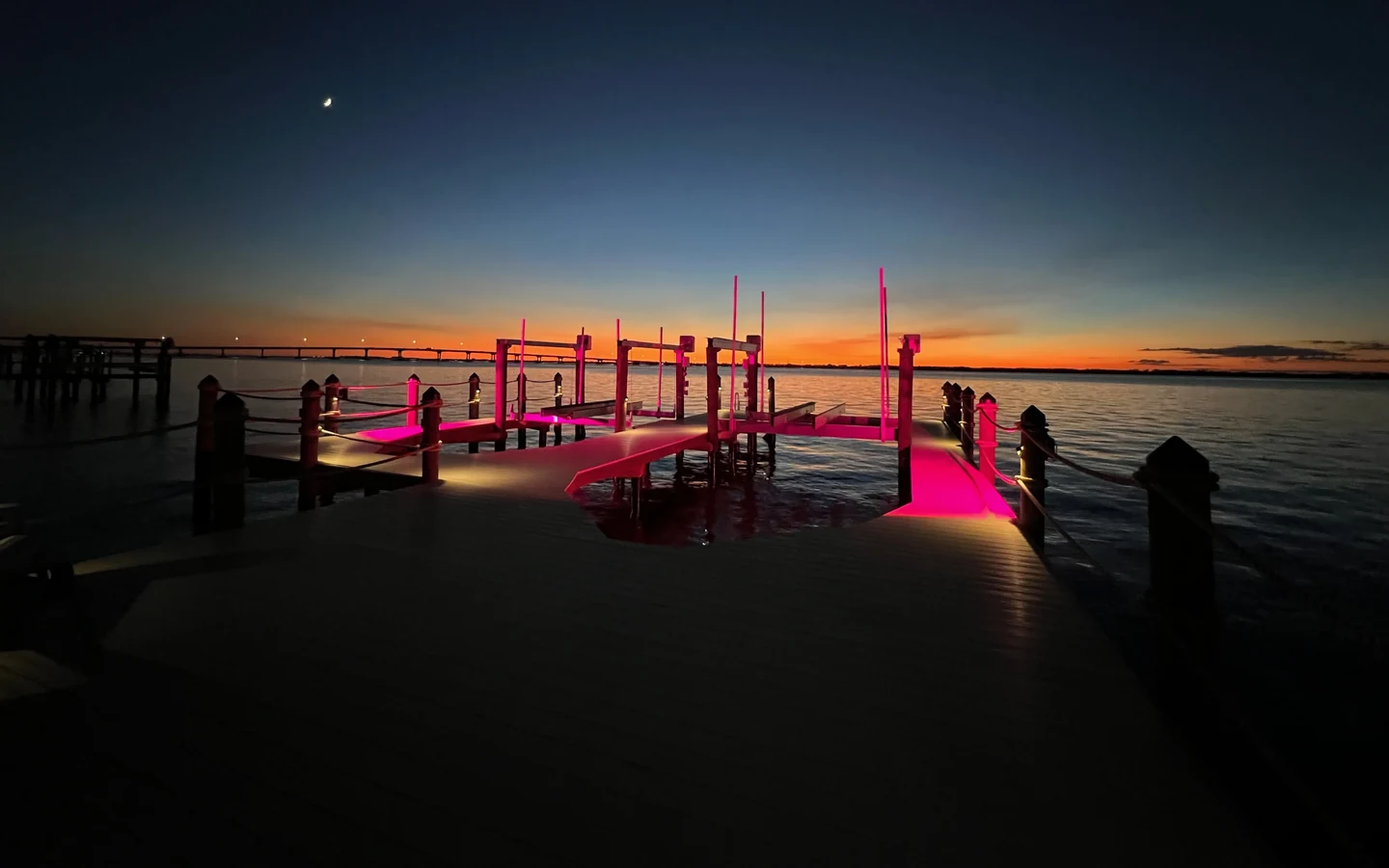 Finished Top Notch Docks waterfront dock with lighting at sunset