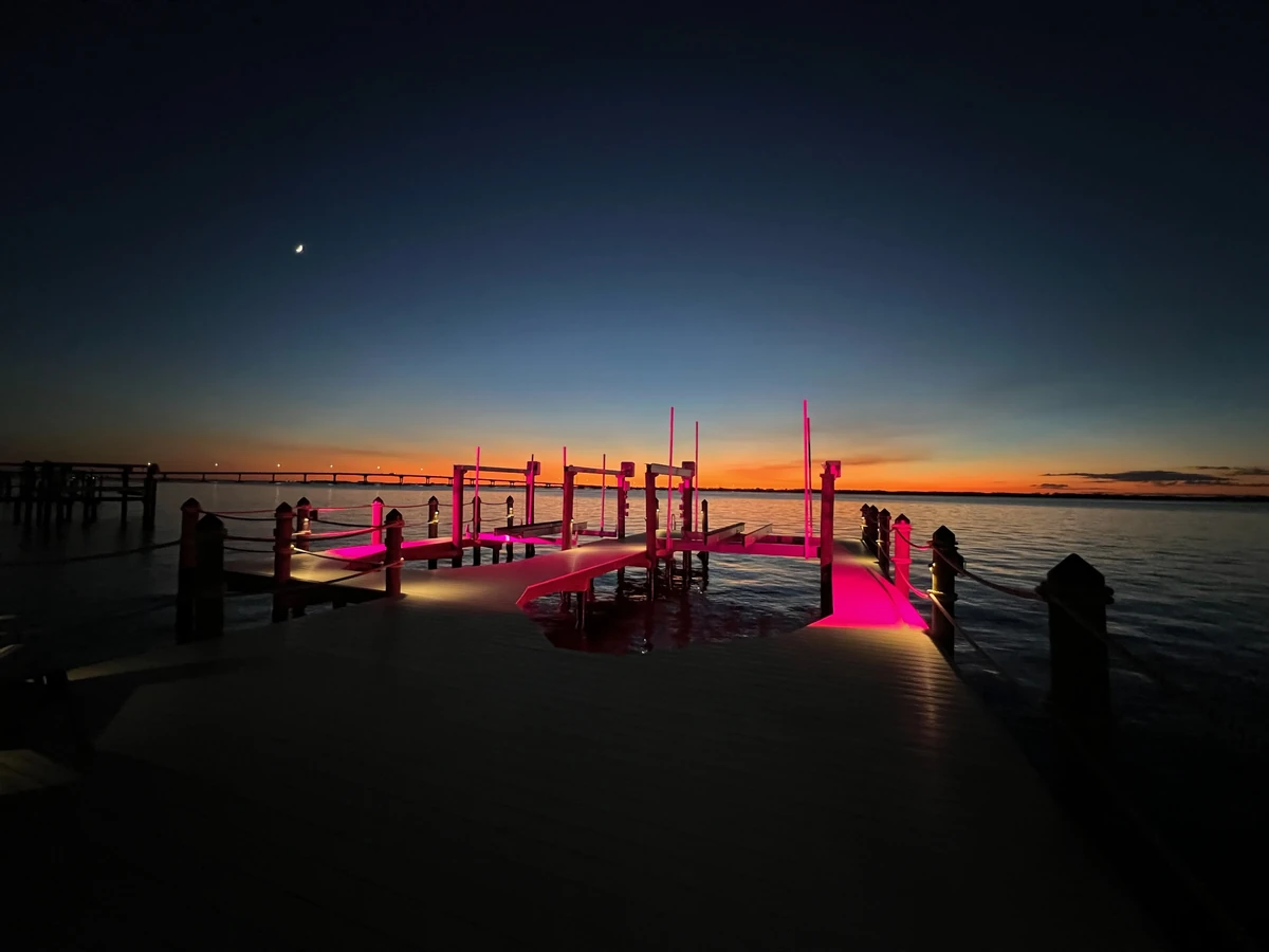 Finished waterfront dock with integrated evening lighting from the Top Notch Docks project library