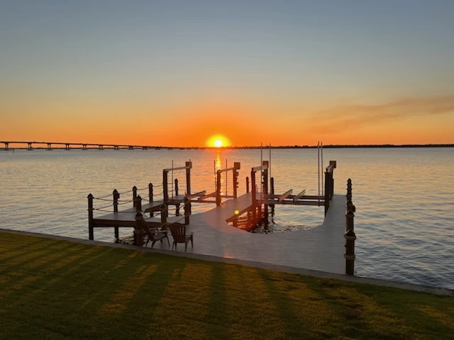Finished waterfront dock at sunset from the Top Notch Docks project library