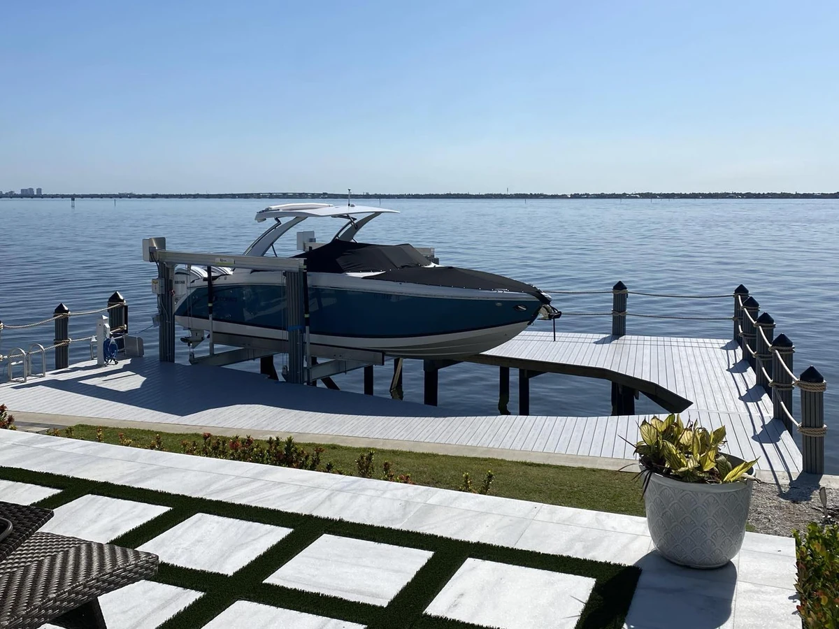 Finished waterfront dock and new boat lift from the Top Notch Docks project library