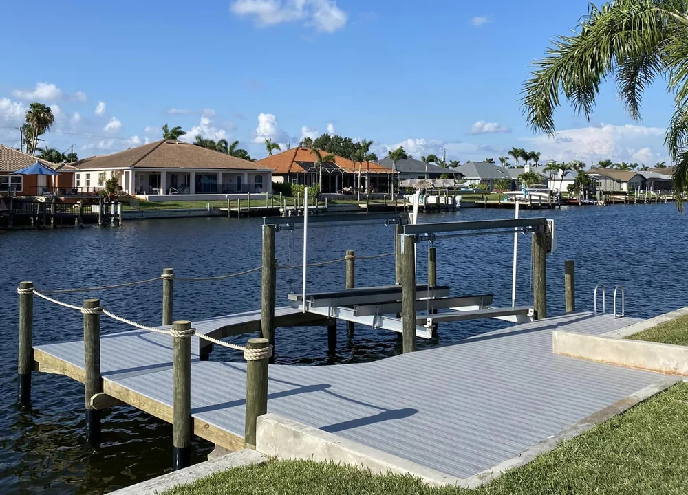 New boat lift integrated with a finished waterfront dock