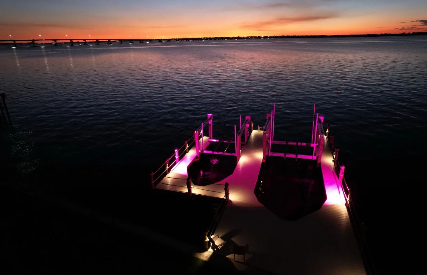 Finished waterfront dock with lighting at sunset