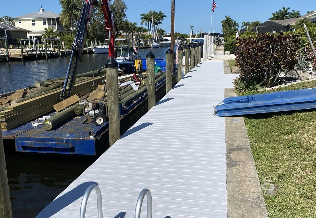 Active marine construction | Top Notch Docks projects Active Top Notch Docks marine construction with crane and dock access