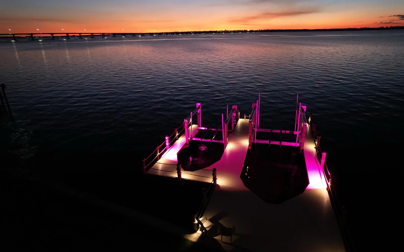 Finished waterfront dock lighting | Top Notch Docks projects Finished Top Notch Docks waterfront dock with lighting at sunset